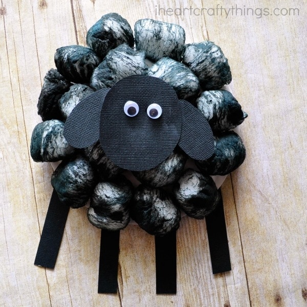 Square image of finished cotton ball sheep craft.