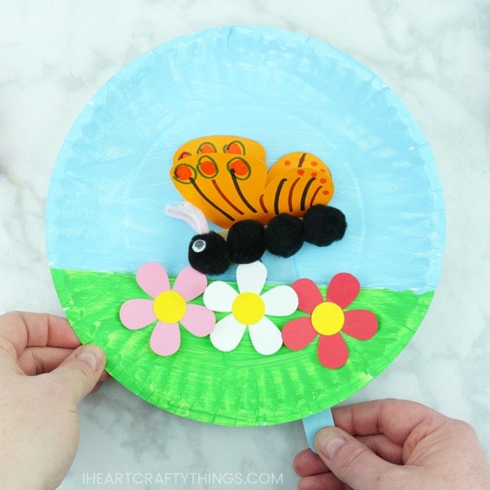 Kids will not only love the creative process of making this paper plate fluttering butterfly craft but afterwards they will have a blast getting to play with it, watching the butterfly flutter along the paper plate. Great spring craft and summer craft for kids.
